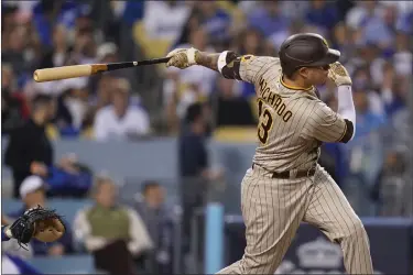  ?? ASHLEY LANDIS — THE ASSOCIATED PRESS FILE ?? San Diego Padres’ Manny Machado follows through on an Rbi-double during the third inning in Game 2 of a baseball NL Division Series against the Los Angeles Dodgers, Oct. 12, 2022, in Los Angeles.