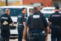  ?? Associated Press ?? ■ Harris County Sheriff Ed Gonzalez walks back to the scene where, according to Gonzalez, three juveniles were found living alone along with the skeletal remains of their sibling in a west Houston apartment.