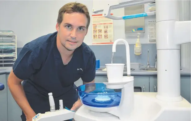  ?? Picture: JACK LAWRIE ?? PRO FLUORIDE: Dr Daniel Baines, of Cairns Dental Group, has noticed a marked difference in the rate of tooth decay compared to Brisbane