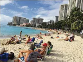  ?? ELLEN CREAGER / DETROIT FREE PRESS ?? Waikiki, in Honolulu, boasts Hawaii’s most famous stretch of beach. With the passage of the plantation heyday, tourism is Hawaii’s main economic driver.