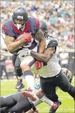  ?? SAM GREENWOOD / GETTY IMAGES ?? Texans running back Arian Foster opened the scoring Sunday with a 14-yard TD catch. He finished with 59 yards receiving and 53 yards rushing. PHELAN M. EBENHACK / AP
Texans third-year wide receiver DeAndre Hopkins caught two touchdown passes Sunday...