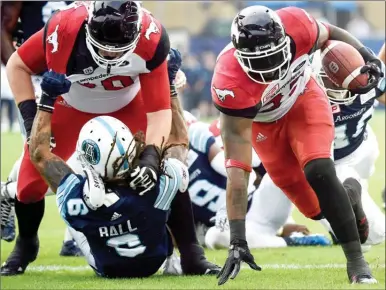  ?? The Canadian Press ?? Calgary Stampeders’ running back Jerome Messam (33) runs in for a touchdown against the Toronto Argonauts in Toronto on Thursday.