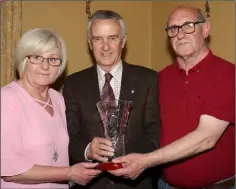  ??  ?? Betty Barnes and Seamus O’Connor receiving George O’Connor’s posthumous hall of fame award from Jim Bolger.