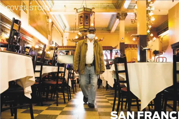  ?? Jessica Christian / The Chronicle ?? Owner Bill Lee walks through the empty dining room at Far East Cafe, one of the last remaining largescale banquet halls in San Francisco’s Chinatown.