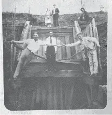  ?? Submitted photo courtesy of Atlanta Citizens Journal ?? Having fun at the Bowie Hill mine shaft entrance in 1930 are, front row from left, H. T. Lummus, Elmer Sherror and Neil, the teacher. Above are Mr. and Mrs. Odis Fuller and a Mr. Penny.