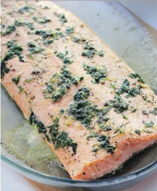  ?? WHI T E C A P ?? The easiest salmon dinner is roasted and then seasoned with herb- flavoured butter.