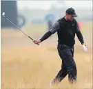  ?? JON SUPER THE ASSOCIATED PRESS ?? Tiger Woods is in the rough on the seventh hole in the second round of the British Open Golf Championsh­ip in Carnoustie, Scotland.
