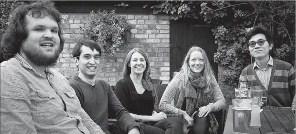  ?? PHOTOS PROVIDED TO CHINA DAILY ?? Hu Xuhui (right) and his classmates while pursuing his second PhD in linguistic­s at Cambridge.