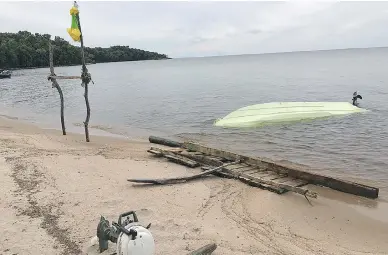  ?? RCMP PHOTO ?? A beam of light reflecting off this capsized boat caught the eye of Const. Jeff Prevett on Aug. 2 and that in turn led to the rescue of marooned boaters Bob Brott and his cousin Gary Soucie.