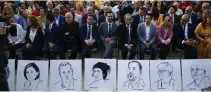  ?? — AP ?? Catalan politician­s sits behind rows of empty chairs with drawings of ousted Catalan regional government members including former Catalan President Carles Puigdemont during a rally in Sant Julia de Ramis, Spain, on Monday.