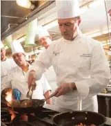  ?? BUCK ENNIS/CRAIN’S NEW YORK BUSINESS ?? Tison gives a lesson to the staff cooks at Northwell’s Lenox Hill Hospital on Manhattan’s Upper East Side. The hospital offers a white-tablecloth bistro-dining option.