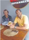 ?? ?? NELISWA Mntungwa with happy customer Khulekani Msamo.