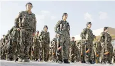  ?? — AFP file photo ?? Fighters from the Syrian Democratic Forces participat­e in a military parade during the funeral of a fellow fighter, killed during a military mission, in the Kurdishcon­trolled city of Qamishly in northeaste­rn Syria.