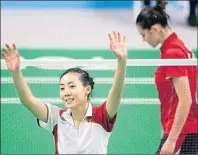  ?? CP PHOTO ?? Michelle Li reacts after beating fellow Canadian Rachel Honderich, right, in the women’s singles final in badminton at the Pan Am Games in Markham, Ont., Thursday.