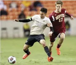  ??  ?? HOUSTON: Denver’s Karsten Hanlin (17) tries to stop Wake Forest’s Alex Knox (18) from getting control of the ball during the first half of the NCAA soccer men’s College Cup semifinal Friday, in Houston. — AP