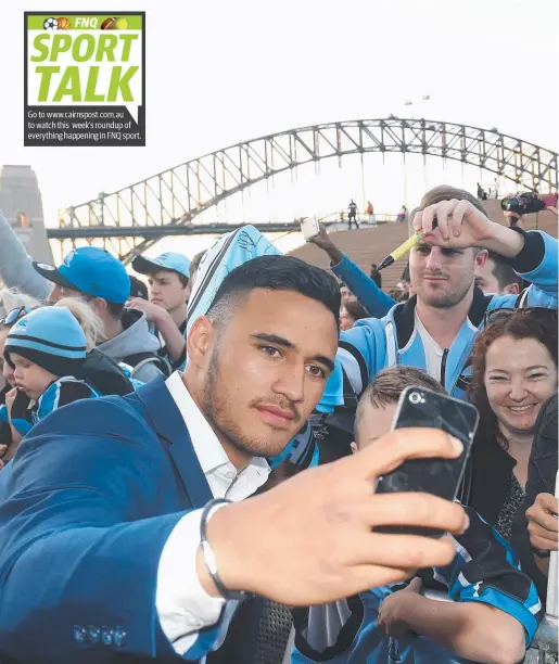  ??  ?? IN THE FRAME: Cronulla’s Valentine Holmes takes a photograph with fans at the Sydney Opera House yesterday before the traditiona­l