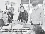  ??  ?? SINGGAH DI KENINGAU: Mohd Lan turut melawat program di PKS Keningau.