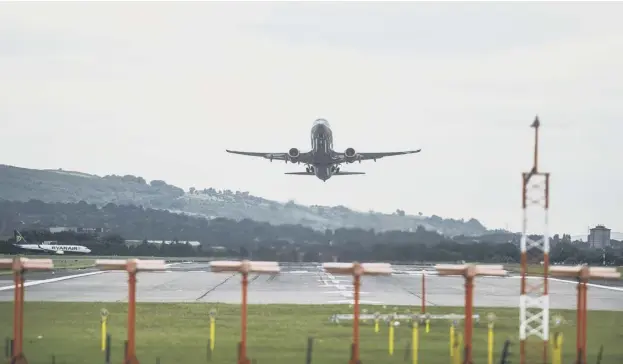  ??  ?? 0 The planned halving of air taxes next year is expected to increase flights from Scotland’s major airports, including Glasgow