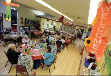  ?? (River Valley Democrat-Gazette/Hank Layton) ?? Visitors play bingo Friday at the Betty Wilkinson Senior Activity Center in Greenwood. Greenwood’s City Council on Monday approved buying about 2 acres at 1917 Excelsior Road for $825,000. The property will be used as the site for a new senior center. Go to nwaonline.com/221009Dail­y/ for today’s photo gallery.