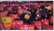  ?? (Photo AFP) ?? Partisans et opposants de la présidente se sont rassemblés et affrontés à Séoul.