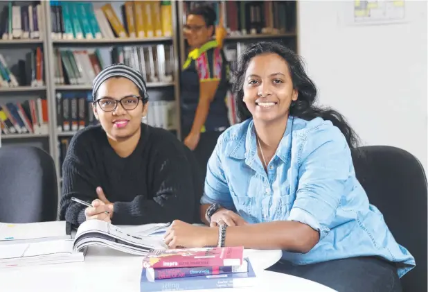  ?? Picture: STEWART McLEAN ?? LESSONS LEARNED: CQUniversi­ty students Nishadi Dharmasena (Masters of public health), Melanie Rickard (Bachelor of IT) and Reshma Vanderweff (Bachelor of creative arts) are ready to get back to study at the Cairns city campus.