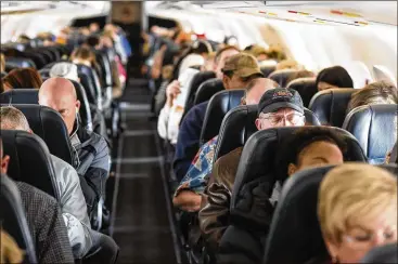  ?? JOE GIRON / THE NEW YORK TIMES ?? It’s not news that airlines have been squeezing more and smaller seats into the backs of their planes. The question is how far they can push their quest for higher profits before running into a backlash from their customers.