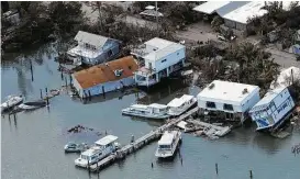  ?? Chris O’ Meara / Associated Press ?? Key West, like the rest of the lower Florida Keys, remained off-limits Tuesday during a search-and-rescue effort as well as repair work on U.S. 1.