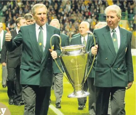  ??  ?? TAKING THE LEAD McNeill and Craig carry the European Cup at the Lisbon Lions testimonia­l match at Parkhead in 2003
