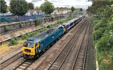  ?? HOWARD LEWSEY. ?? On June 7, GB Railfreigh­t 47749 CITY
OF TRURO leads Greater Anglia 360105 and GBRf 47727 Edinburgh Castle/Caisteal Dhun Eideann through Forest Gate, with the 1110 Ilford-King’s Heath, taking the ‘360’ for modificati­ons ahead of a transfer to East Midlands Railway later this year.