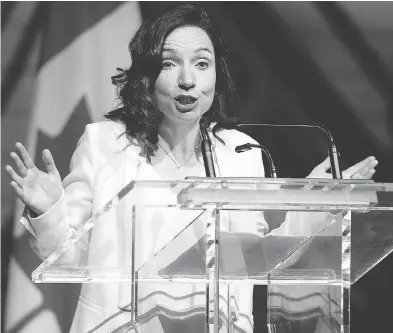  ?? JUSTIN TANG / THE CANADIAN PRESS ?? Bloc Québécois Leader Martine Ouellet jokes during her speech at the Parliament­ary Press Gallery dinner in Gatineau, Que., last month. BQ members voted on the weekend against Ouellet’s leadership by a two-to-one margin.