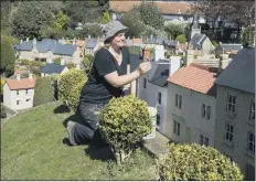  ?? PICTURES: TONY JOHNSON ?? LITTLE TOUCHES: Left and above, gardener Sophie Revitt makes final preparatio­ns at Bondville Model Village; below, Oliver Whitehead in the harbour; inset, co-owner Jan Whitehead. There is a waterfall, three pubs, and a cricket pitch.