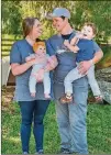  ??  ?? Grateful Pastures owners Sabrina Terry and Shaun Terry take a breather with their 3-year-old son, Jackson, and infant daughter, Lilah.