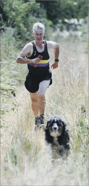  ?? PICTURE: SCOTT MERRYLEES. ?? SWIFT RECOVERY: David Holmes underwent robotic surgery to remove his prostate – now, just a month later, he is fit enough to go running with his dog Rusty.