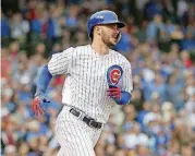  ?? [AP PHOTO] ?? Chicago Cubs’ Kris Bryant rounds the bases after hitting a solo home run off Cardinals pitcher Adam Wainwright during the fourth inning Friday in Chicago.