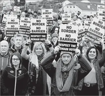  ?? PAUL FAITH/GETTY-AFP ?? Sinn Fein Northern Leader Michelle O’Neill, center, joins protesters Saturday against any barrier between Ireland and Northern Ireland. Barrier fears are rising over a no-deal Brexit.