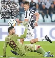  ?? – REUTERSPIX ?? Juventus’ Paulo Dybala (right) scores their fourth goal past Torino goalkeeper Salvatore Sirigu during their Serie A match at the Juventus Stadium in Turin yesterday.