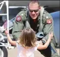  ?? PROVIDED ?? John Capizzi greets one of his thenyoung daughters in 2010.