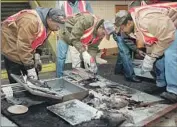  ?? ROSARIO ESPOSITO Associated Press ?? WORKERS dismantle a charred subway tollbooth wall after the deadly 1995 attack in Brooklyn, N.Y.