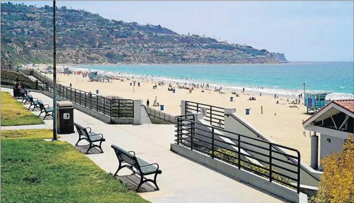  ??  ?? TORRANCE BEACH, which is 40 acres, has a bike path, beach wheelchair­s, showers, volleyball nets, a concession stand and several hundred parking spaces.