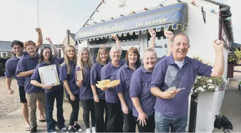  ??  ?? Martin Mills (right) and his staff at Weldons Fisheries at Eye