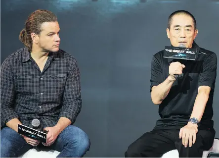  ?? THE ASSOCIATED PRESS ?? The Great Wall director Zhang Yimou, right, seen with Matt Damon, says Damon’s role was never conceived for a Chinese actor.