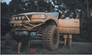  ??  ?? After a day of wheeling, members of the Apex Overland team check for any
damage.