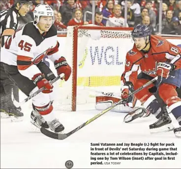  ?? USA TODAY ?? Sami Vatanen and Jay Beagle (r.) fight for puck in front of Devils’ net Saturday during game that features a lot of celebratio­ns by Capitals, including one by Tom Wilson (inset) after goal in first period.