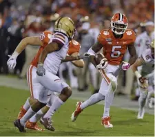  ?? AP ?? TOO MUCH: Clemson’s Tee Higgins takes off against the BC defense.