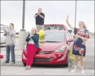  ??  ?? Lincoln High celebrated its graduates in May with a drivethrou­gh ceremony.