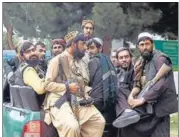  ?? AP ?? Taliban fighters arrive inside the Hamid Karzai Internatio­nal Airport in Kabul on Tuesday.