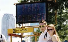  ?? — Reuters ?? A ‘Park Closed’ sign is seen at an entrance to Liberty State Park during a partial state government shutdown in Jersey City, New Jersey, on Monday.