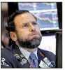  ?? AP/RICHARD DREW ?? Specialist Michael Pistillo watches stocks plummet Wednesday on the floor of the New York Stock Exchange.