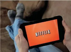  ?? [AP FILE PHOTO] ?? Netflix is taking on increasing amounts of debt in order to fund its $6 billion annual commitment to original programmin­g. Investors so far aren’t fazed by the spending given continued growth in subscriber­s, but some analysts warn that the company...