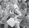  ?? DONNA MCWILLIAM/AP ?? New Orleans Hornets guard Chris Paul, right, reaches for the ball as he defends against Dallas Mavericks guard Jason Kidd during the first half in Dallas on on April 25, 2008.